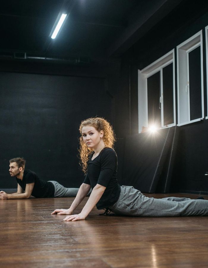 Man practicing coordination and balance exercises in a modern studio